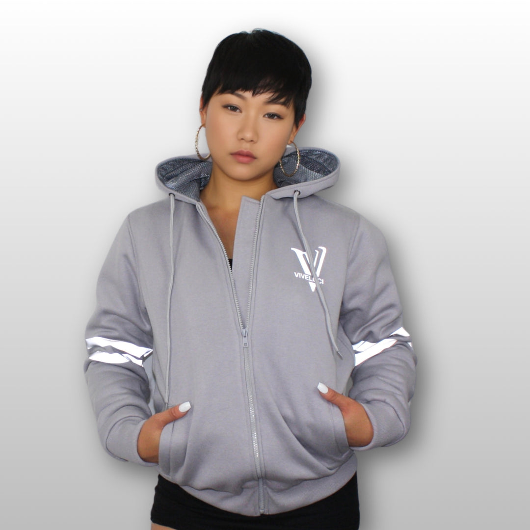Hanna is wearing a silver grey ViVeloci Kevlar Lined, Armored, Motorcycle Hoodie. Reflective back, front and arm bands.  Removable CE Level 1 Armor in Shoulders, Elbows and Back. Two zippered pockets on the outside and one on the inside.