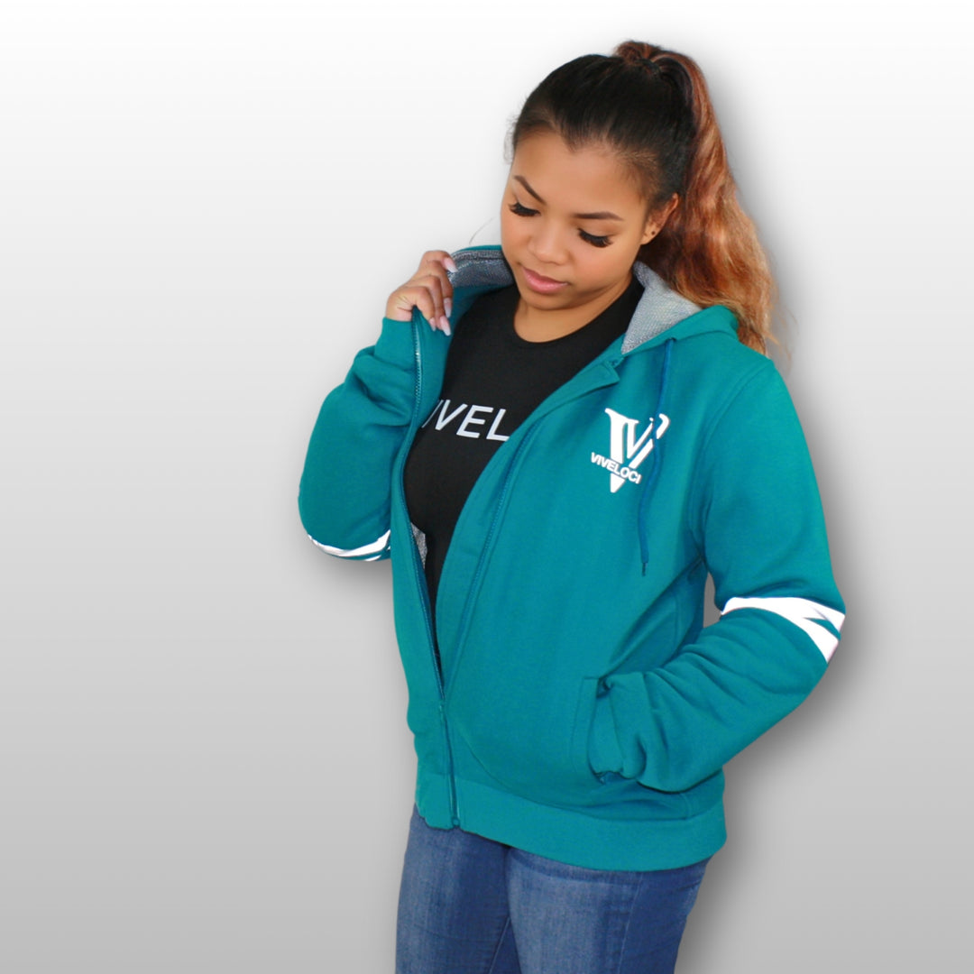 Ro is wearing a ViVeloci Kevlar Lined, Armored, Motorcycle Hoodie in Teal.  Reflective back, front and arm bands.  Removable CE Level 1 Armor in Shoulders, Elbows and Back. Two zippered pockets on the outside and one on the inside.