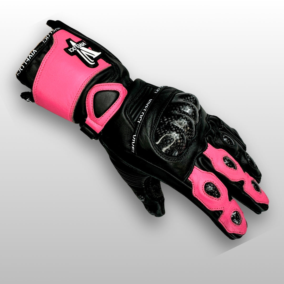 Carbon fiber knuckle armor on women’s pink and black leather full gauntlet motorcycle gloves