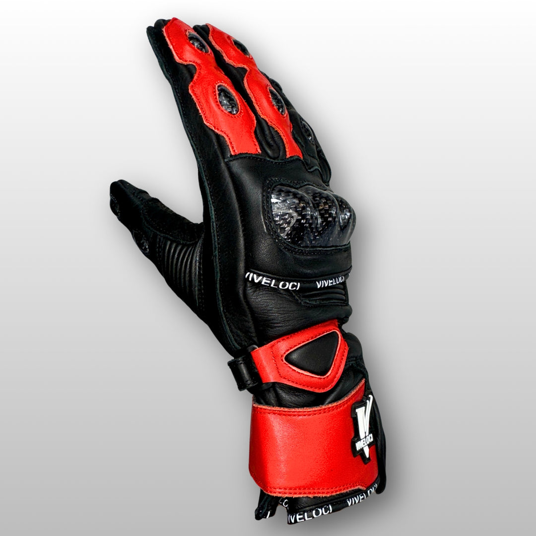 Carbon fiber knuckle armor on women’s red and black leather full gauntlet motorcycle gloves