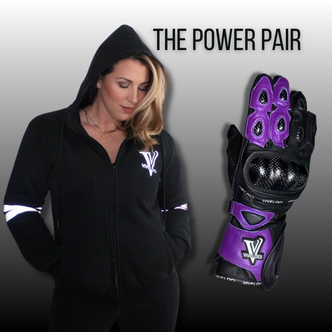Woman wearing a black ViVeloci hoodie next to a ViVeloci black and purple glove on a gray background.