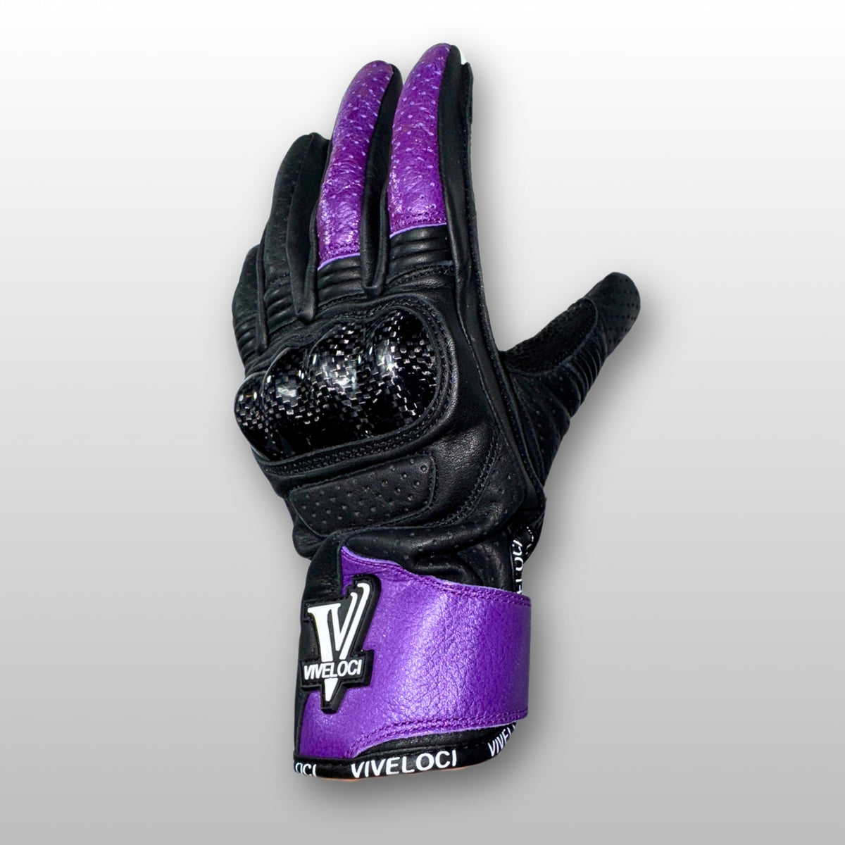Women’s leather motorcycle gloves with carbon fiber knuckles in purple.