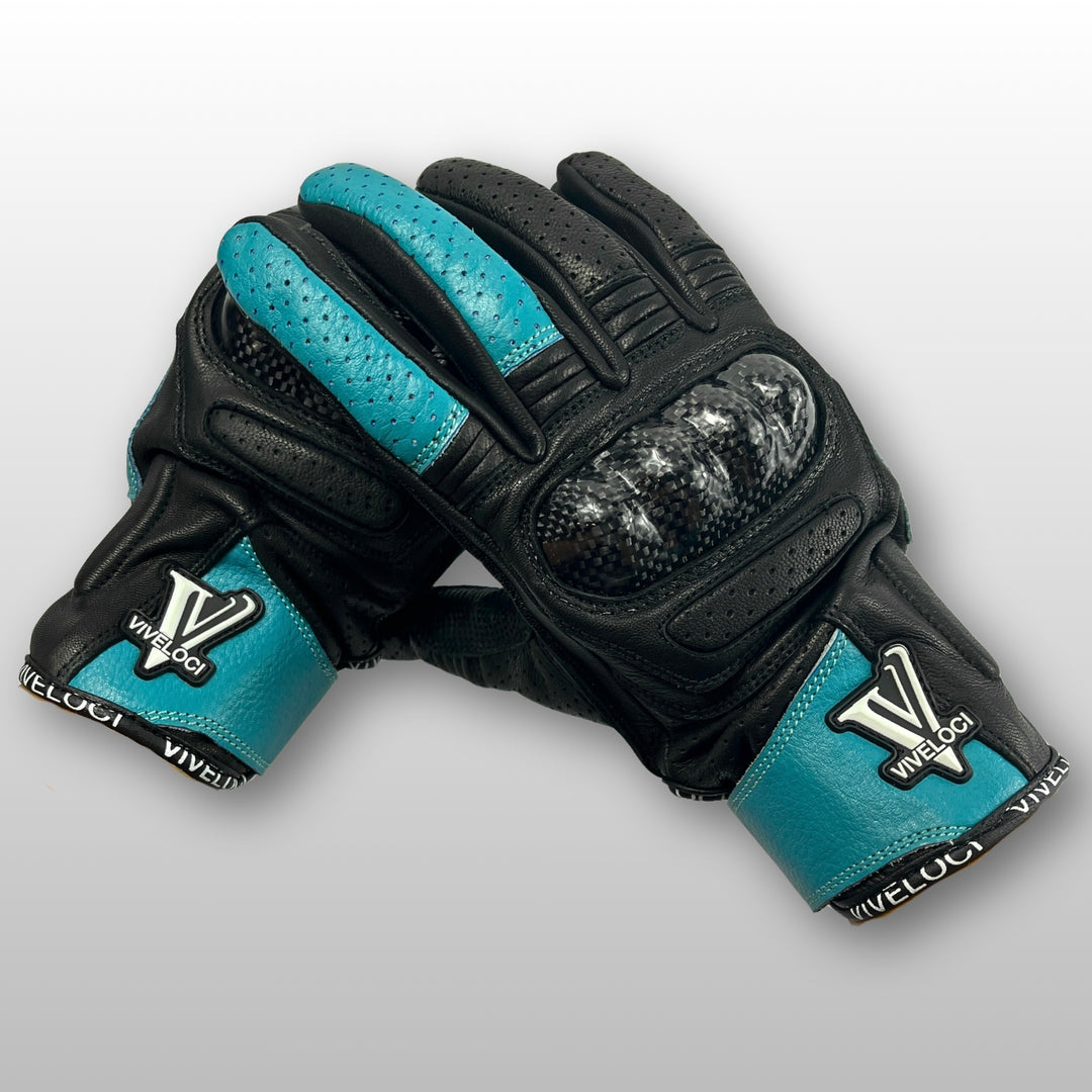 Women’s leather motorcycle gloves with carbon fiber knuckles in teal.