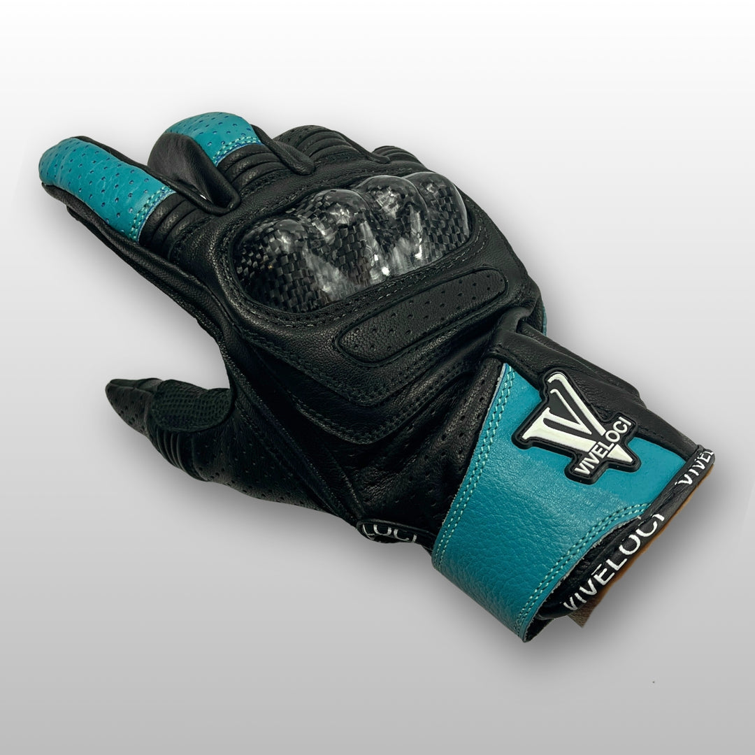 Women’s leather motorcycle gloves with carbon fiber knuckles in teal.