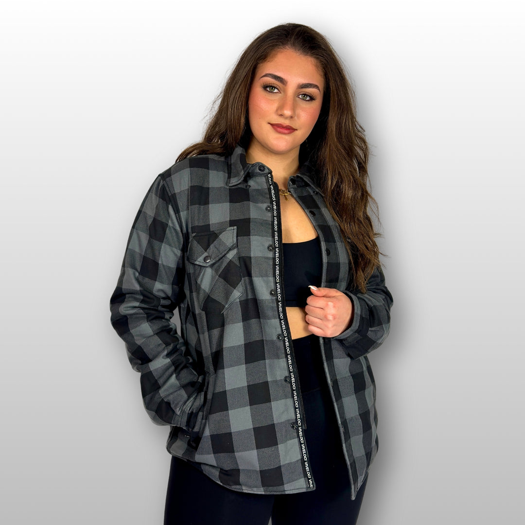 Bernadette wearing Viveloci Women's Grey and Black Kevlar Lined Armored Riding Flannel for women against grey background.