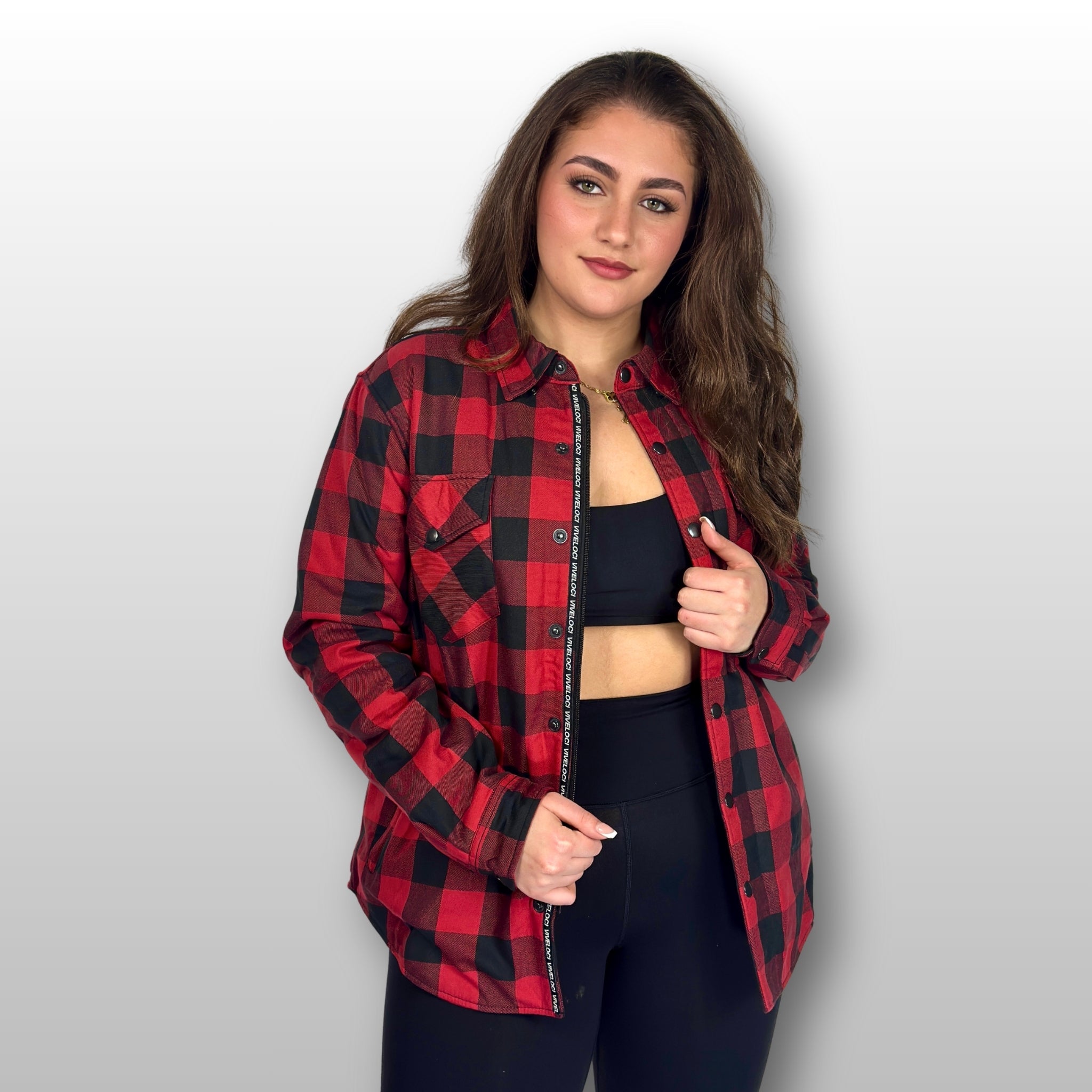 Bernadette wearing Viveloci Red and Black Kevlar Lined Armored Riding Flannel for women. Zipper and Snaps along front. Snaps on cuffs and collar