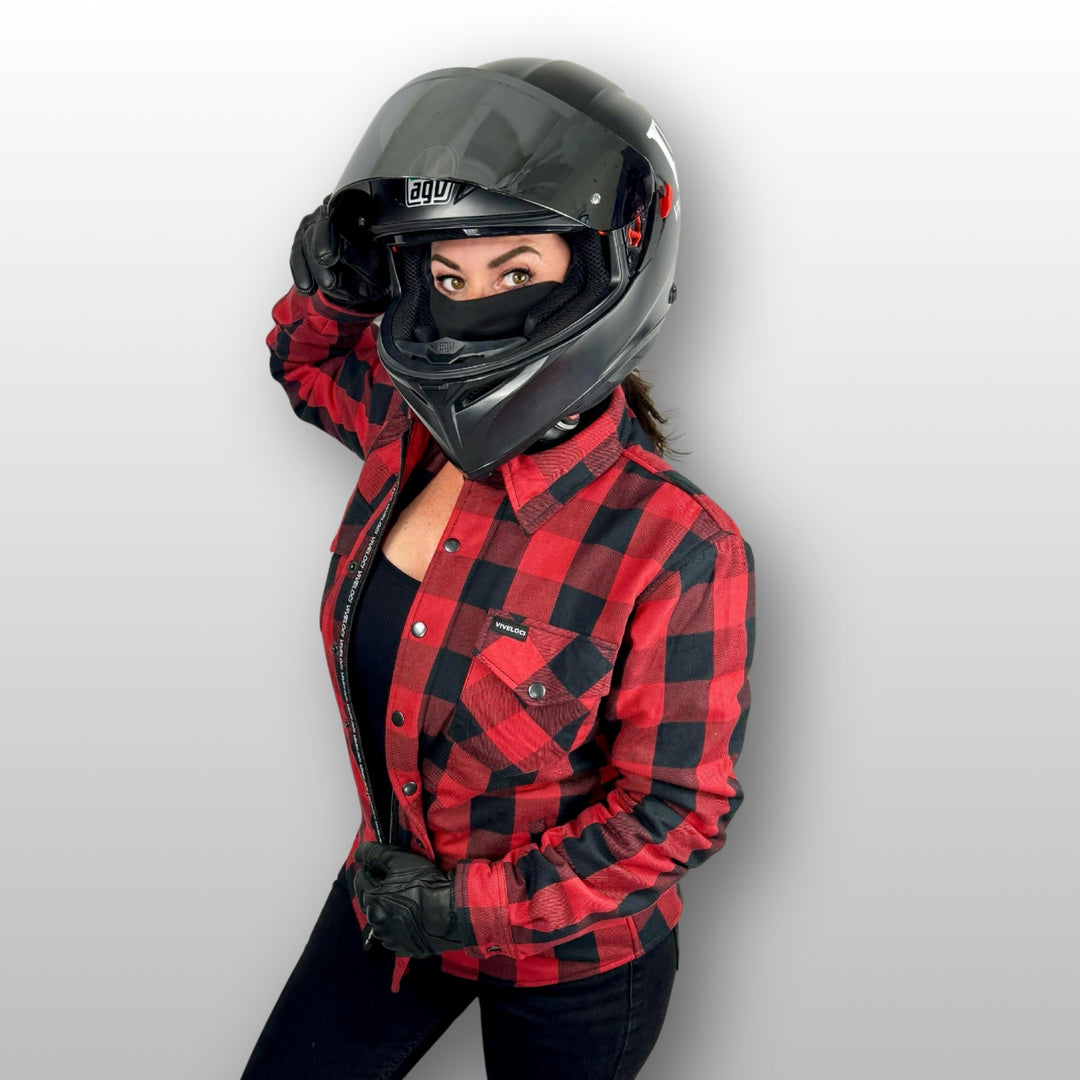 Chrissy wearing Viveloci Women's Red and Black Kevlar Lined Armored Riding Flannel for women against grey background.