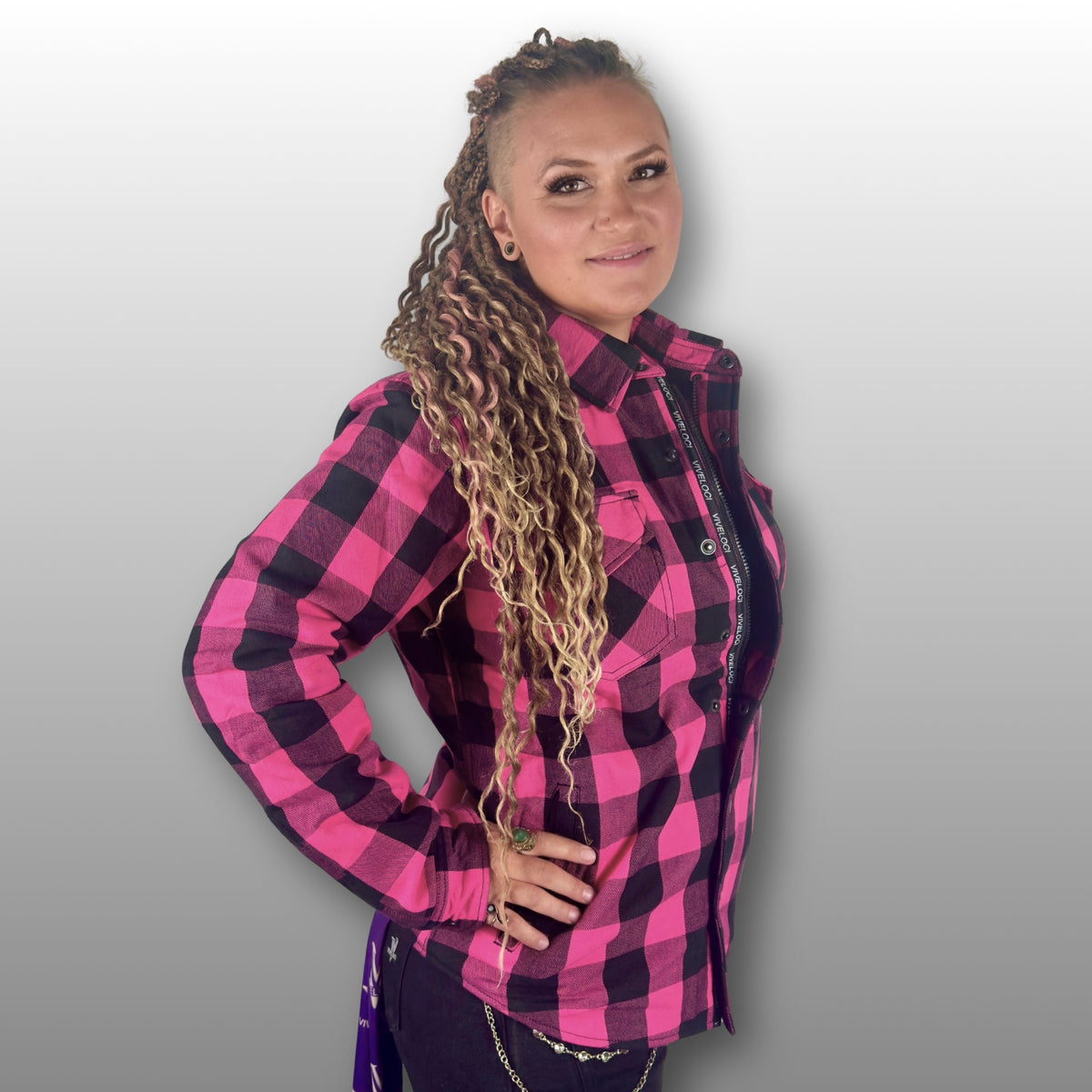 Women’s pink motorcycle riding flannel with Kevlar lining, CE level 1 armor, and Class AA certification