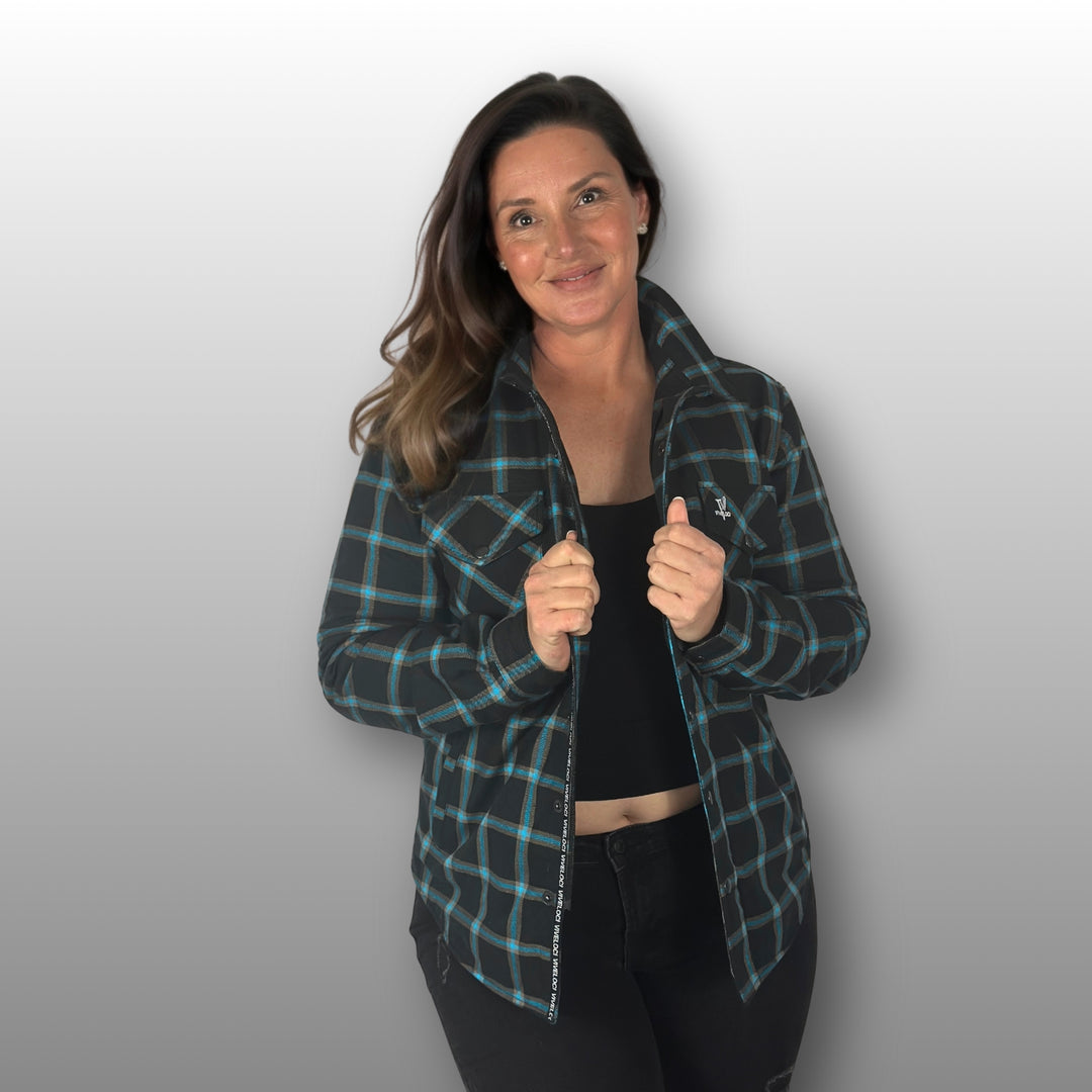 Deanna wearing teal and black Armored Riding Flannel