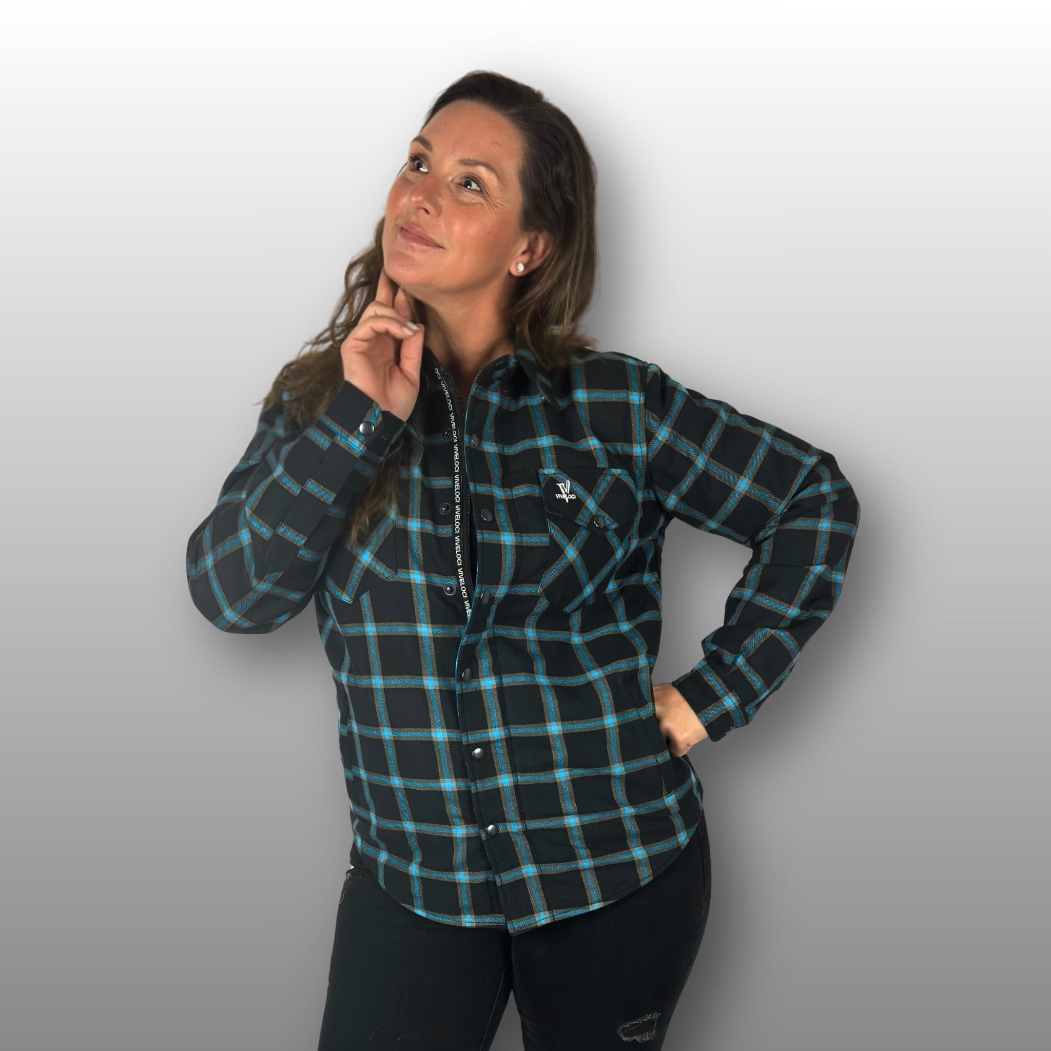 Deanna wearing teal and black Armored Riding Flannel