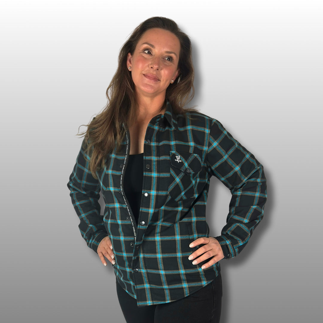 Deanna wearing teal and black Armored Riding Flannel