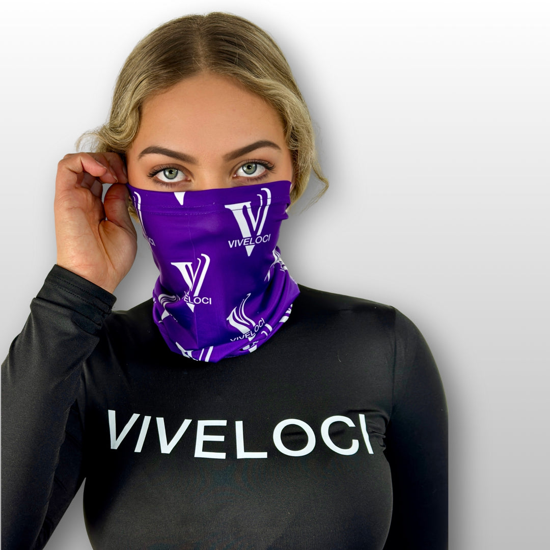 Bella wearing a purple Viveloci neck gaiter and a black Viveloci bodysuit