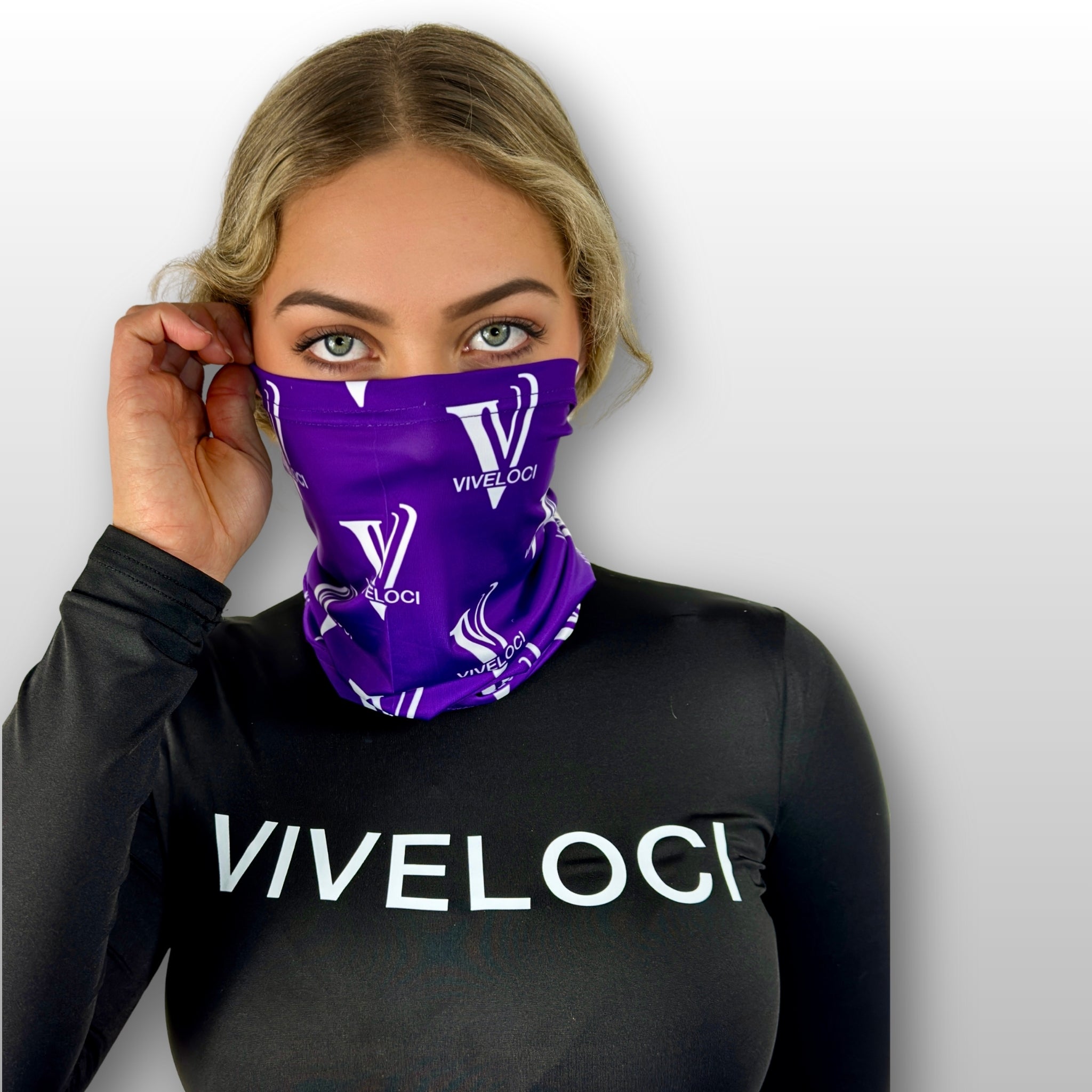 Bella wearing a purple Viveloci neck gaiter and a black Viveloci bodysuit