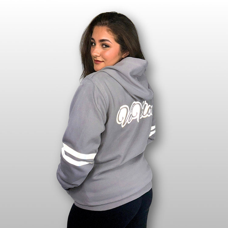 Bernadette is wearing a ViVeloci Kevlar Lined, Armored, Motorcycle Hoodie in Silver Grey.  Reflective back, front and arm bands.  Removable CE Level 1 Armor in Shoulders, Elbows and Back. Two zippered pockets on the outside and one on the inside.