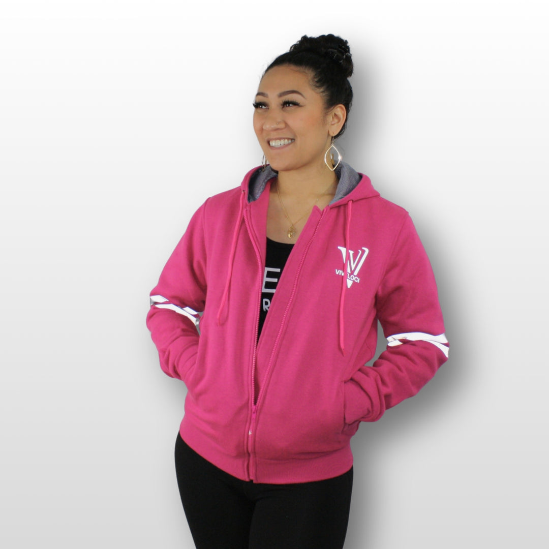 Lani is wearing a ViVeloci Kevlar Lined, Armored, Motorcycle Hoodie in Pink.  Reflective back, front and arm bands.  Removable CE Level 1 Armor in Shoulders, Elbows and Back. Two zippered pockets on the outside and one on the inside.