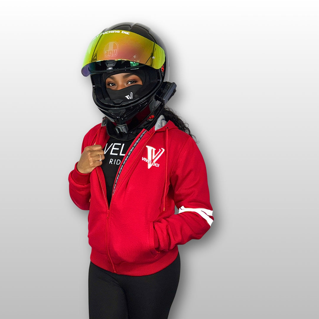 Aaliyah is wearing a ViVeloci Kevlar Lined, Armored, Motorcycle Hoodie in Red.  Reflective back, front and arm bands.  Removable CE Level 1 Armor in Shoulders, Elbows and Back. Two zippered pockets on the outside and one on the inside.