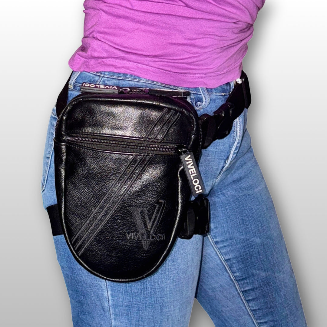 Black leather leg bag with visible ViVeloci branding worn by a woman in blue jeans