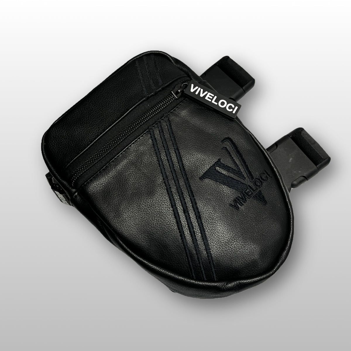 Black leather thigh bag with 'Viveloci' branding on a light gray background